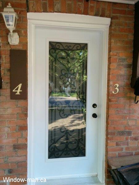 Single steel insulated front entry exterior door. White color. Full glass Port Stanly wrought iron glass insert